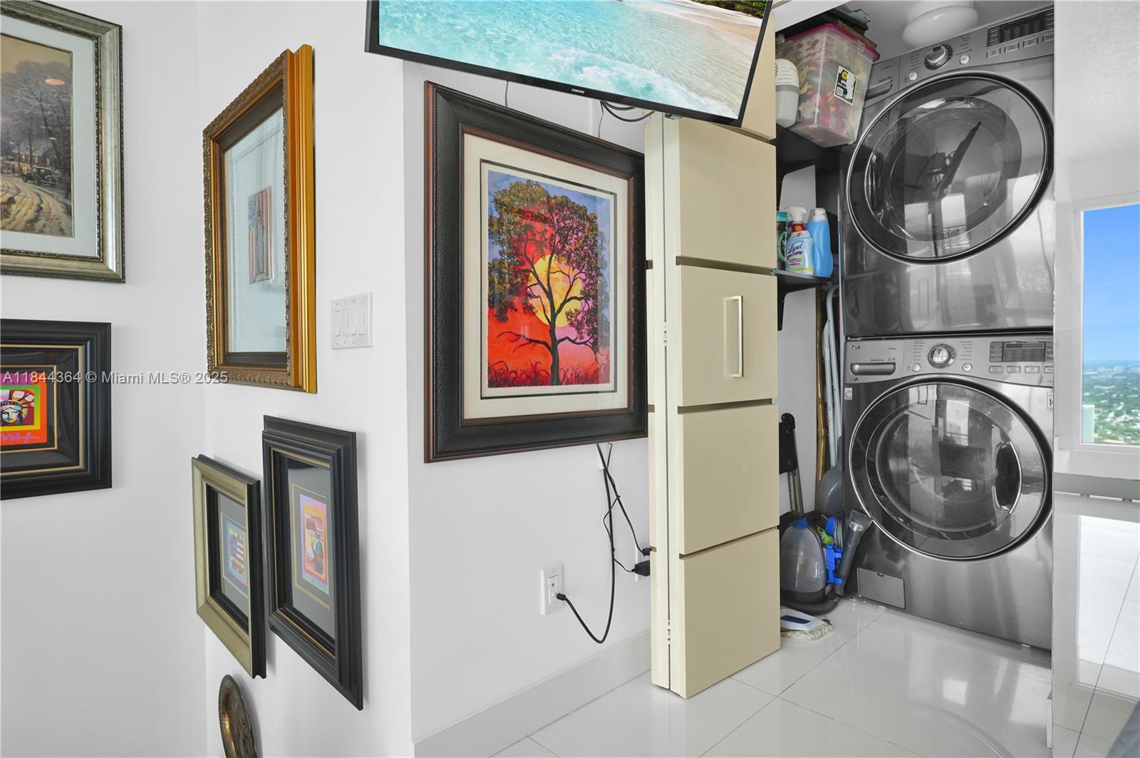 60 Southwest 13th Street, Unit 4411 Miami, FL 33130 - Photo 17 of 38 a view of a storage & utility room with washer and dryer