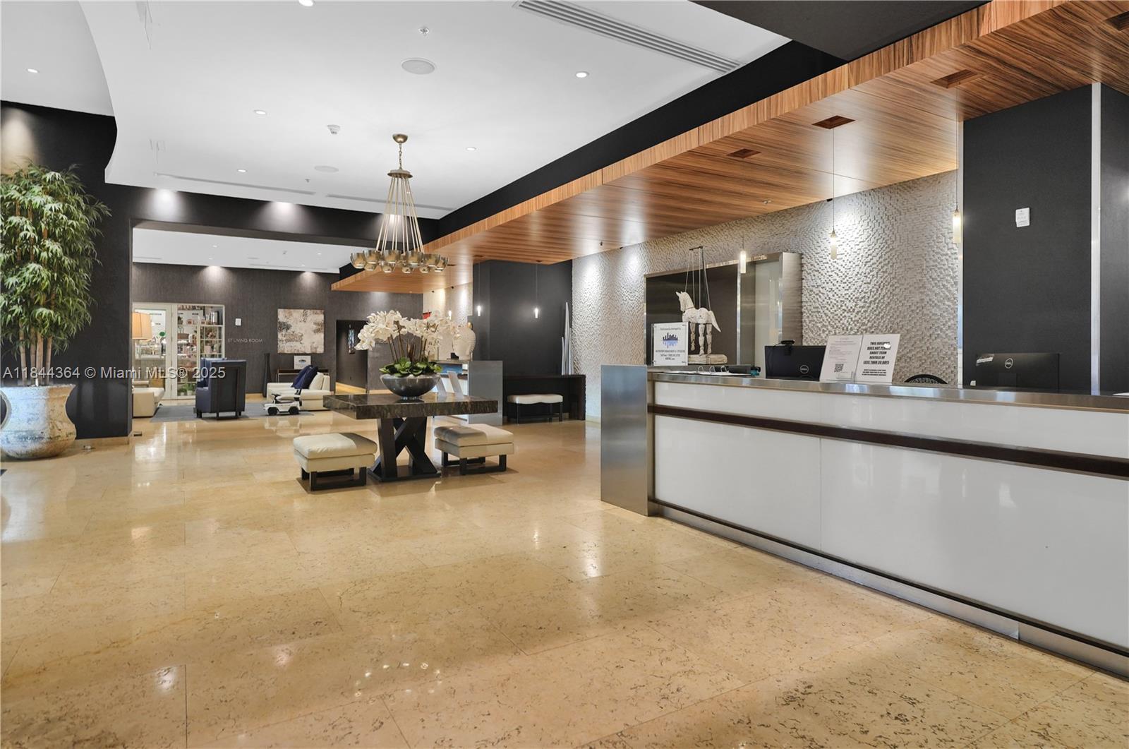 60 Southwest 13th Street, Unit 4411 Miami, FL 33130 - Photo 18 of 38 a lobby with furniture and a large window