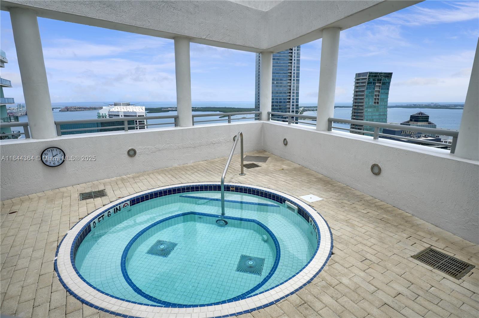 60 Southwest 13th Street, Unit 4411 Miami, FL 33130 - Photo 26 of 38 a bathroom with a sink and mirror