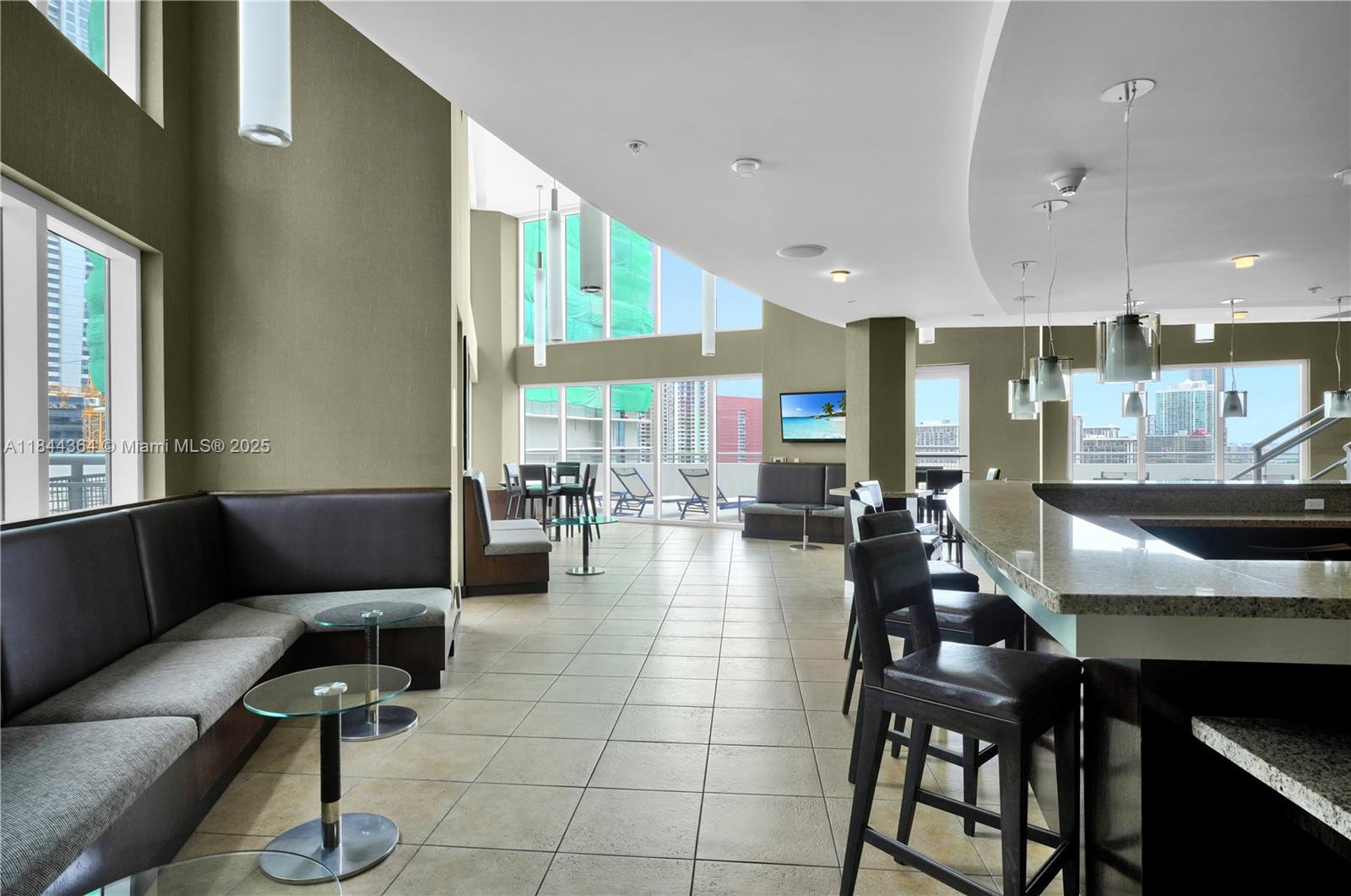 60 Southwest 13th Street, Unit 4411 Miami, FL 33130 - Photo 29 of 38 a living room with furniture and a large window