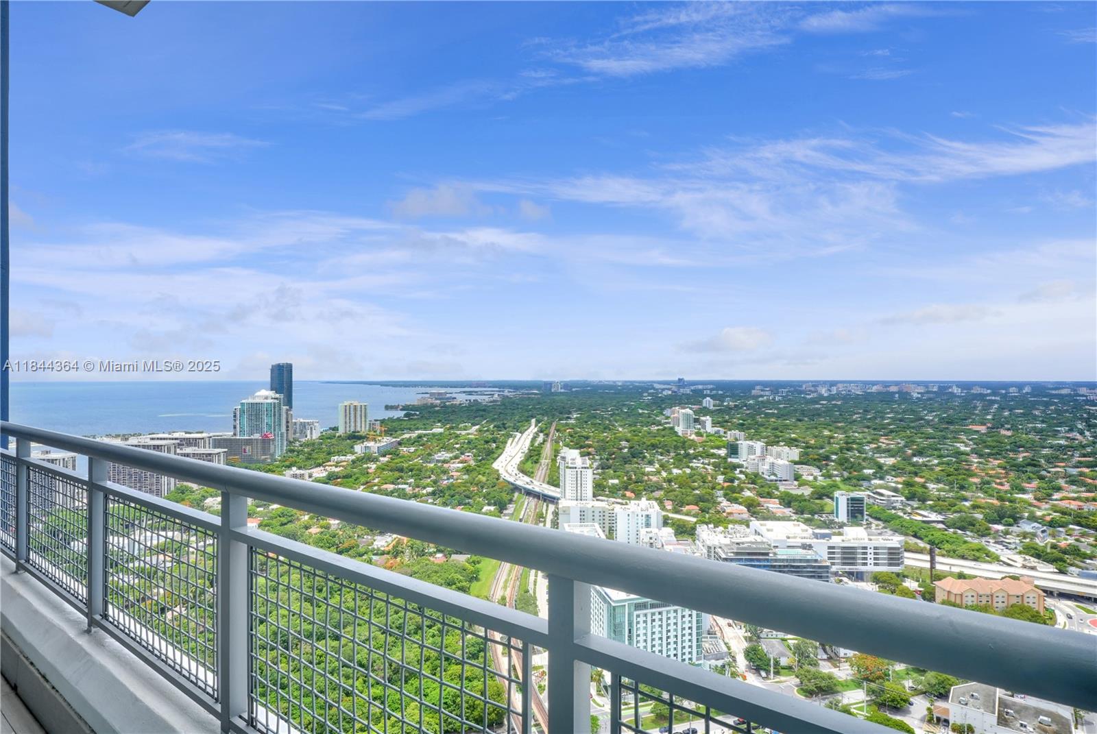 60 Southwest 13th Street, Unit 4411 Miami, FL 33130 - Photo 34 of 38 a view of a city skyline from a balcony