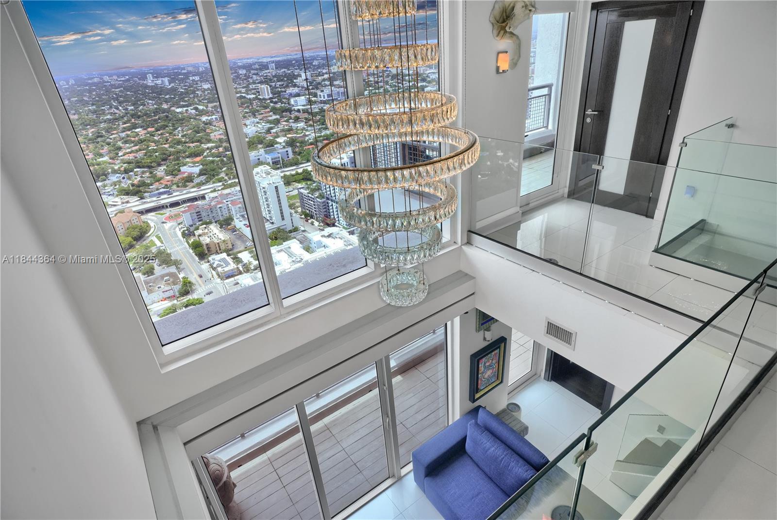 60 Southwest 13th Street, Unit 4411 Miami, FL 33130 - Photo 6 of 38 a picture of a living room with a fireplace