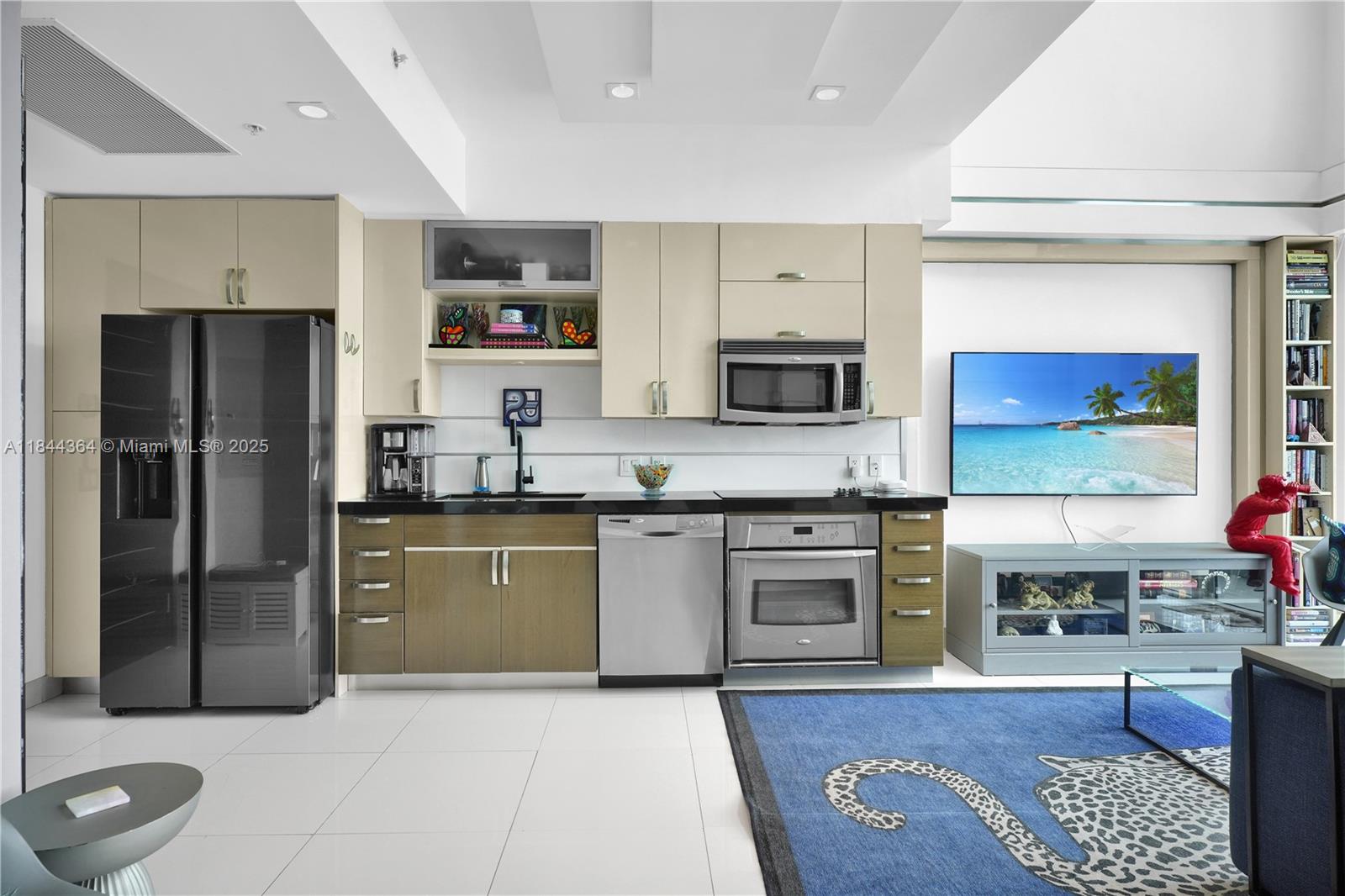 60 Southwest 13th Street, Unit 4411 Miami, FL 33130 - Photo 8 of 38 a kitchen with stainless steel appliances granite countertop a refrigerator stove top oven and sink