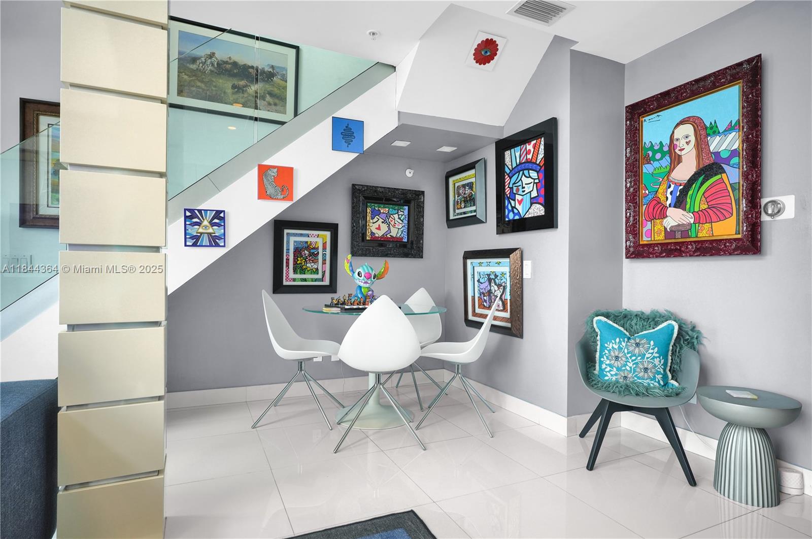 60 Southwest 13th Street, Unit 4411 Miami, FL 33130 - Photo 9 of 38 a living room with furniture and a painting on the wall