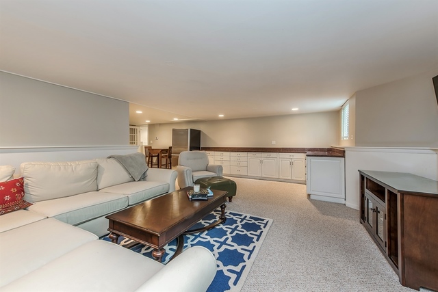 72 Abbotsford Road Winnetka, IL 60093 - Photo 22 of 29 a living room with furniture and a rug