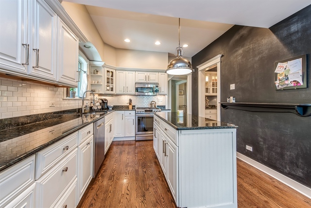72 Abbotsford Road Winnetka, IL 60093 - Photo 7 of 29 a kitchen with stainless steel appliances granite countertop a stove a sink and a refrigerator