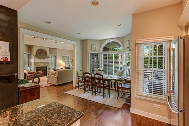 72 Abbotsford Road Winnetka, IL 60093 - Photo 8 of 29 a living room with furniture and a large window