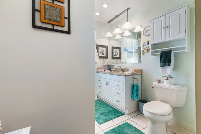 a bathroom with a sink a vanity and a mirror