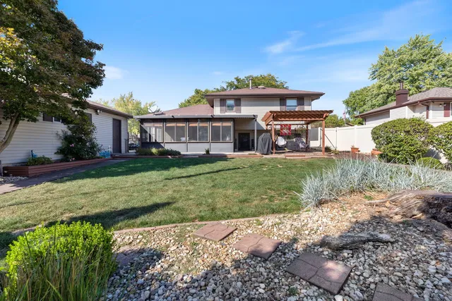 a view of a house with a yard porch and sitting area