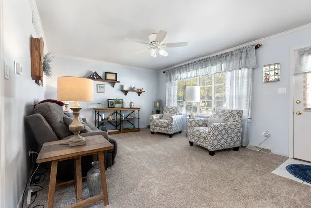 a living room with furniture and a window