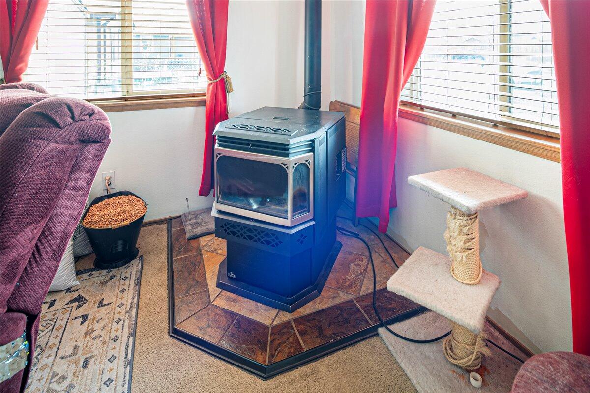 216 Southwest 3rd Street Redmond, OR 97756 - Photo 3 of 22 Warm pellet stove