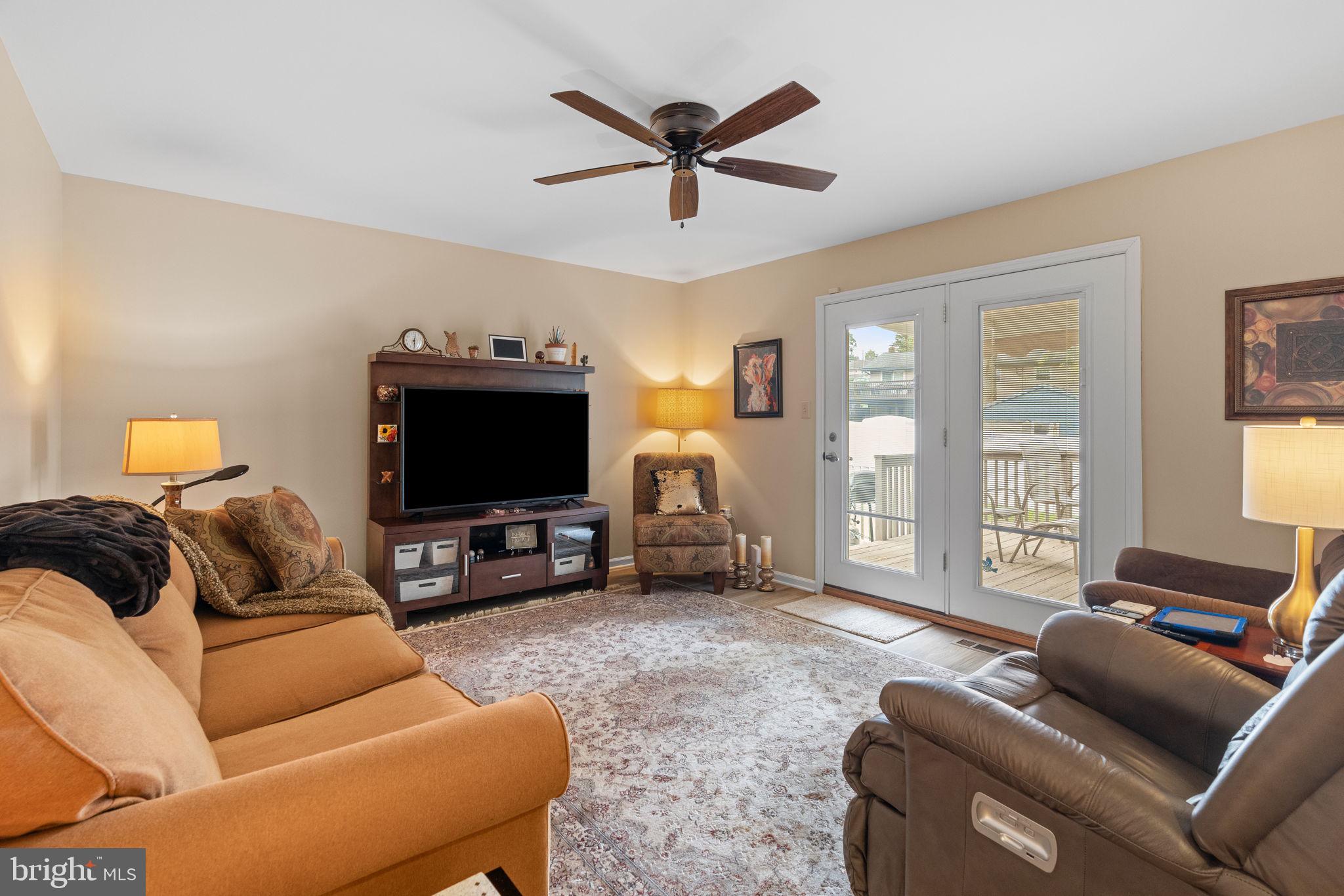 1036 Boeshore Circle Reading, PA 19605 - Photo 20 of 52 a living room with furniture and a flat screen tv