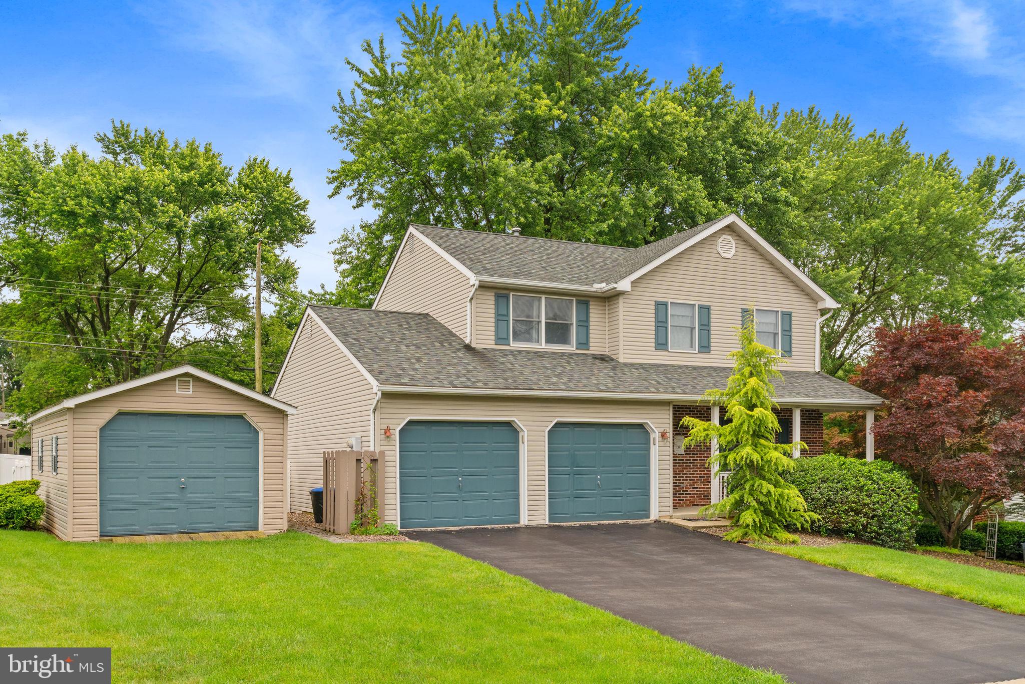 1036 Boeshore Circle Reading, PA 19605 - Photo 2 of 52 a front view of a house with a yard and garage