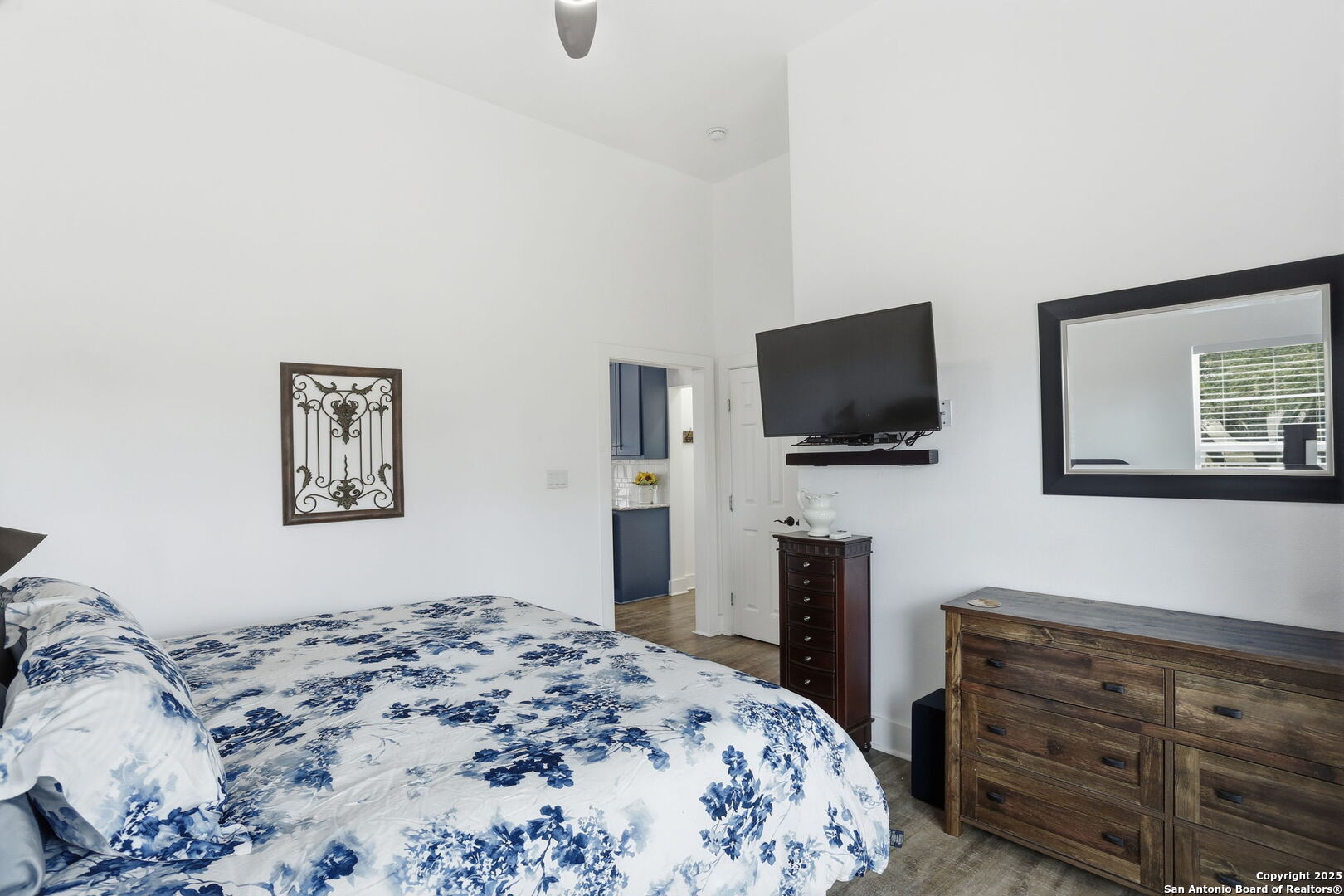 116 Martingale Trail Bandera, TX 78003 - Photo 12 of 40 a bedroom with a bed and a flat screen tv