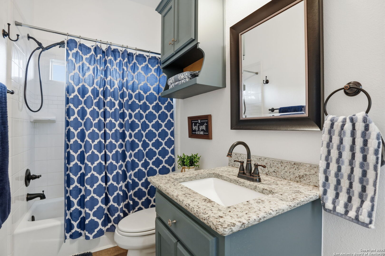 116 Martingale Trail Bandera, TX 78003 - Photo 16 of 40 a bathroom with a granite countertop sink and a mirror