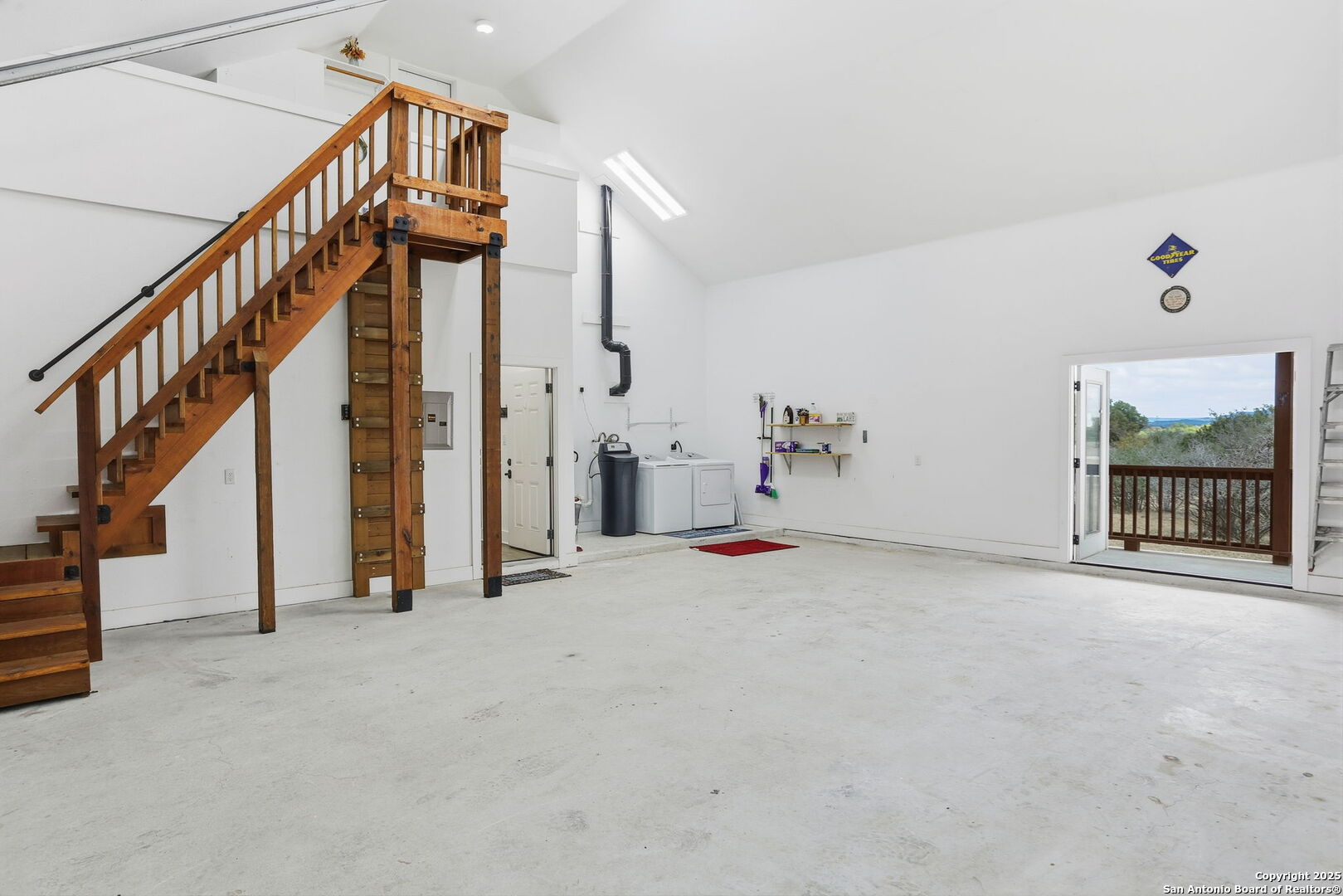 116 Martingale Trail Bandera, TX 78003 - Photo 19 of 40 a view of an empty room with stairs and a window