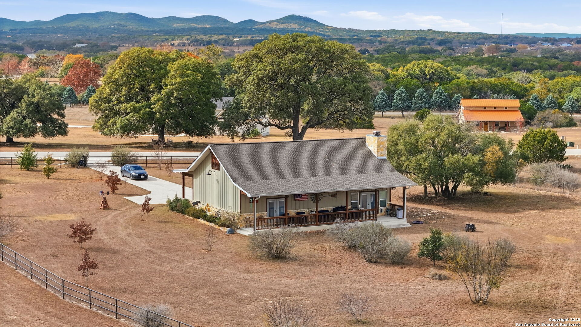 116 Martingale Trail Bandera, TX 78003 - Photo 30 of 40 an aerial view of a house with a yard and a large tree
