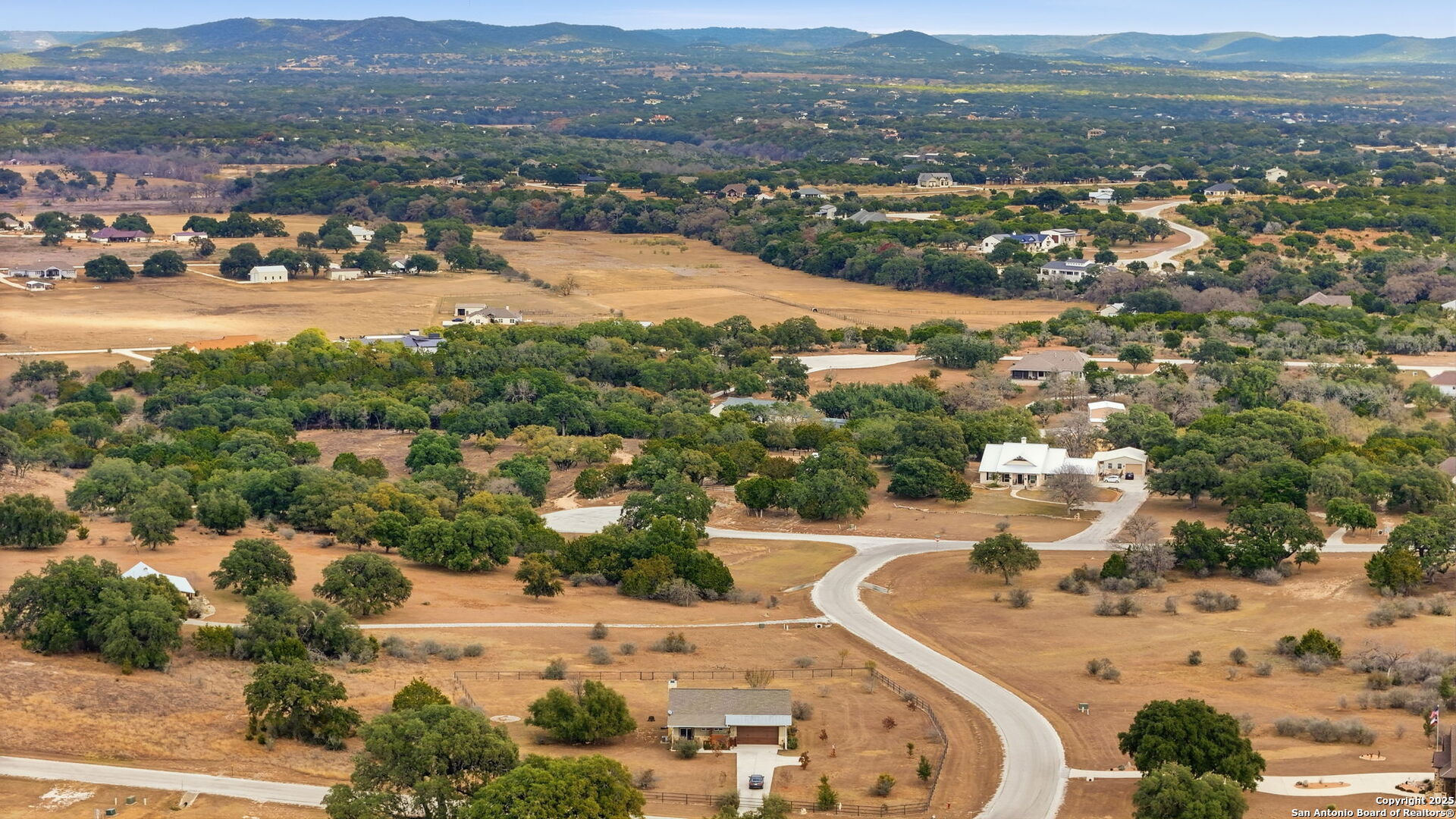 116 Martingale Trail Bandera, TX 78003 - Photo 31 of 40 an aerial view of residential house with yard and mountain view in back