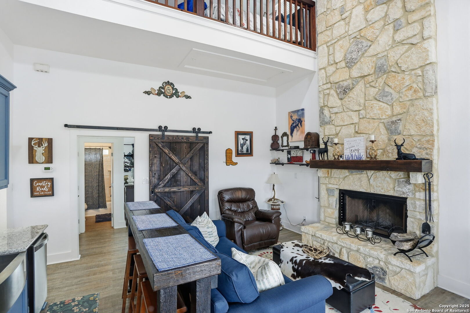 116 Martingale Trail Bandera, TX 78003 - Photo 6 of 40 a living room with furniture and a fireplace