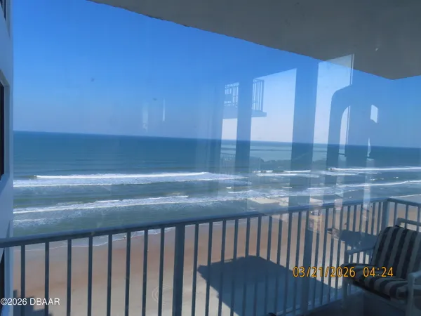 a kitchen with wooden cabinets and a wooden floor