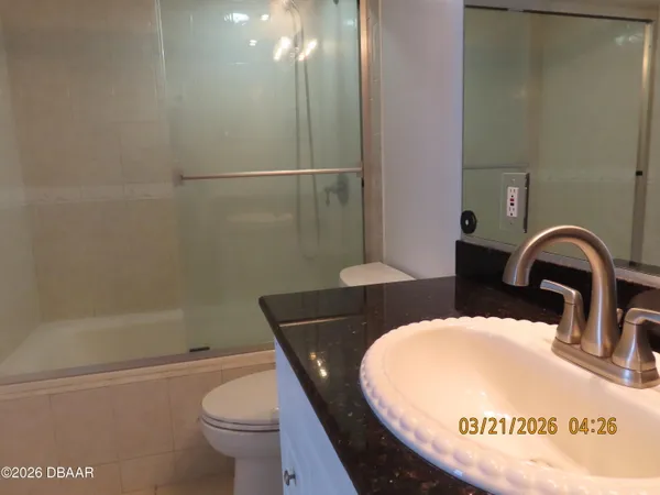 a living room with fireplace furniture and a flat screen tv