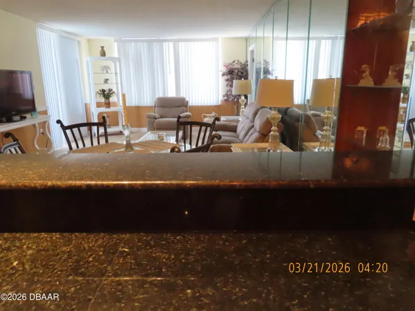 a kitchen with stainless steel appliances granite countertop a sink stove and microwave