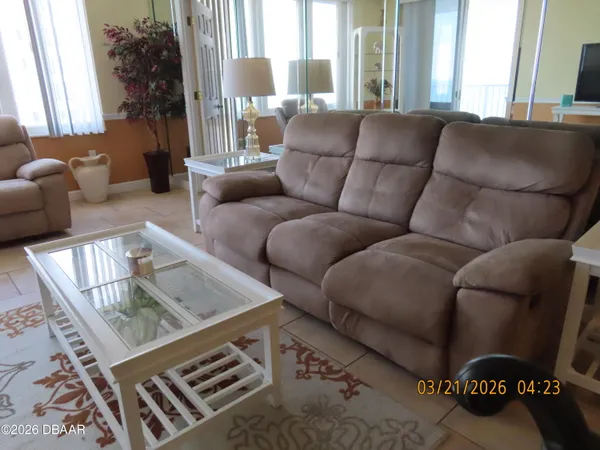 a living room with furniture and a window