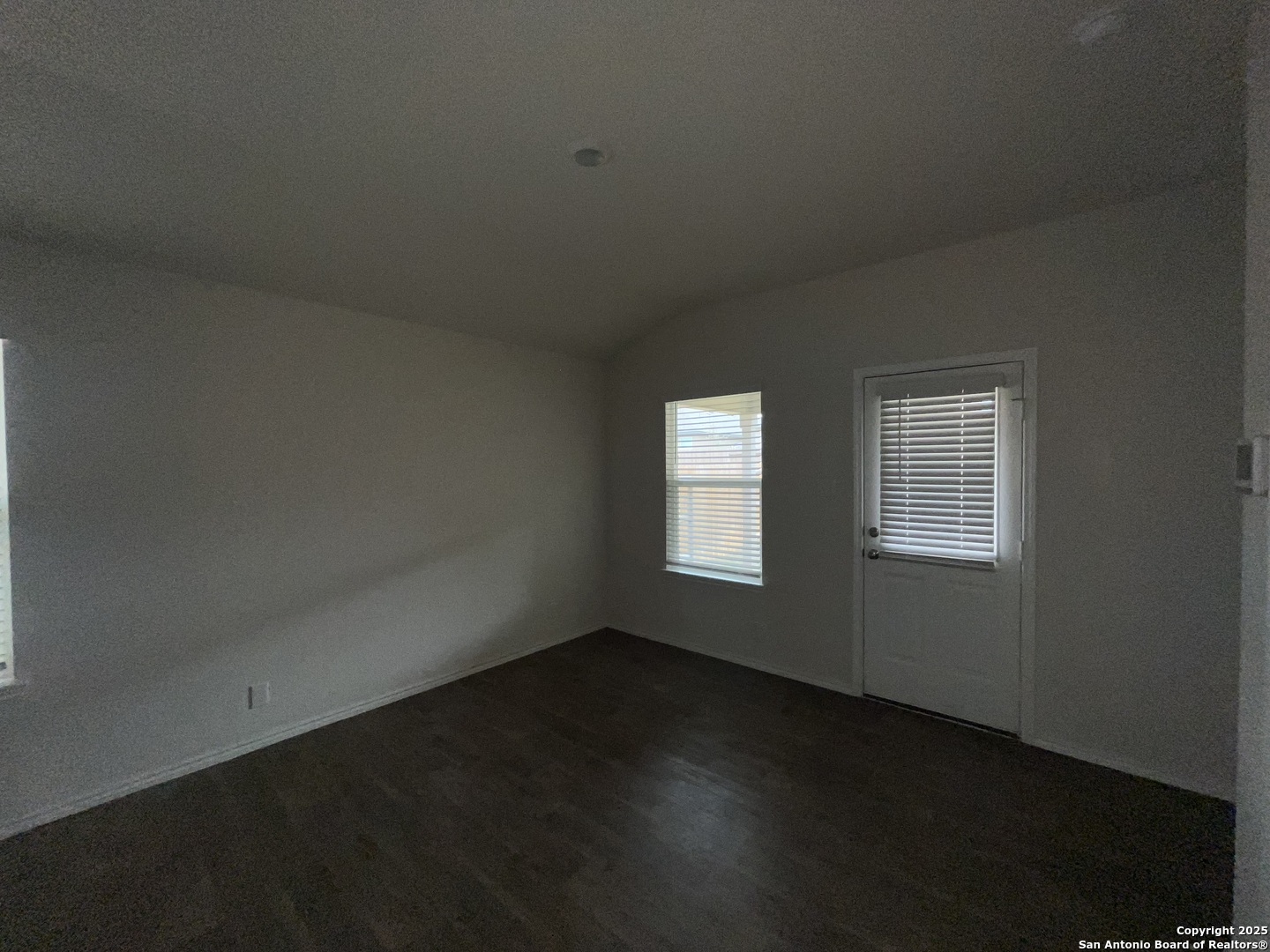 324 Middle Green Loop Floresville, TX 78114 - Photo 11 of 30 an empty room with a window
