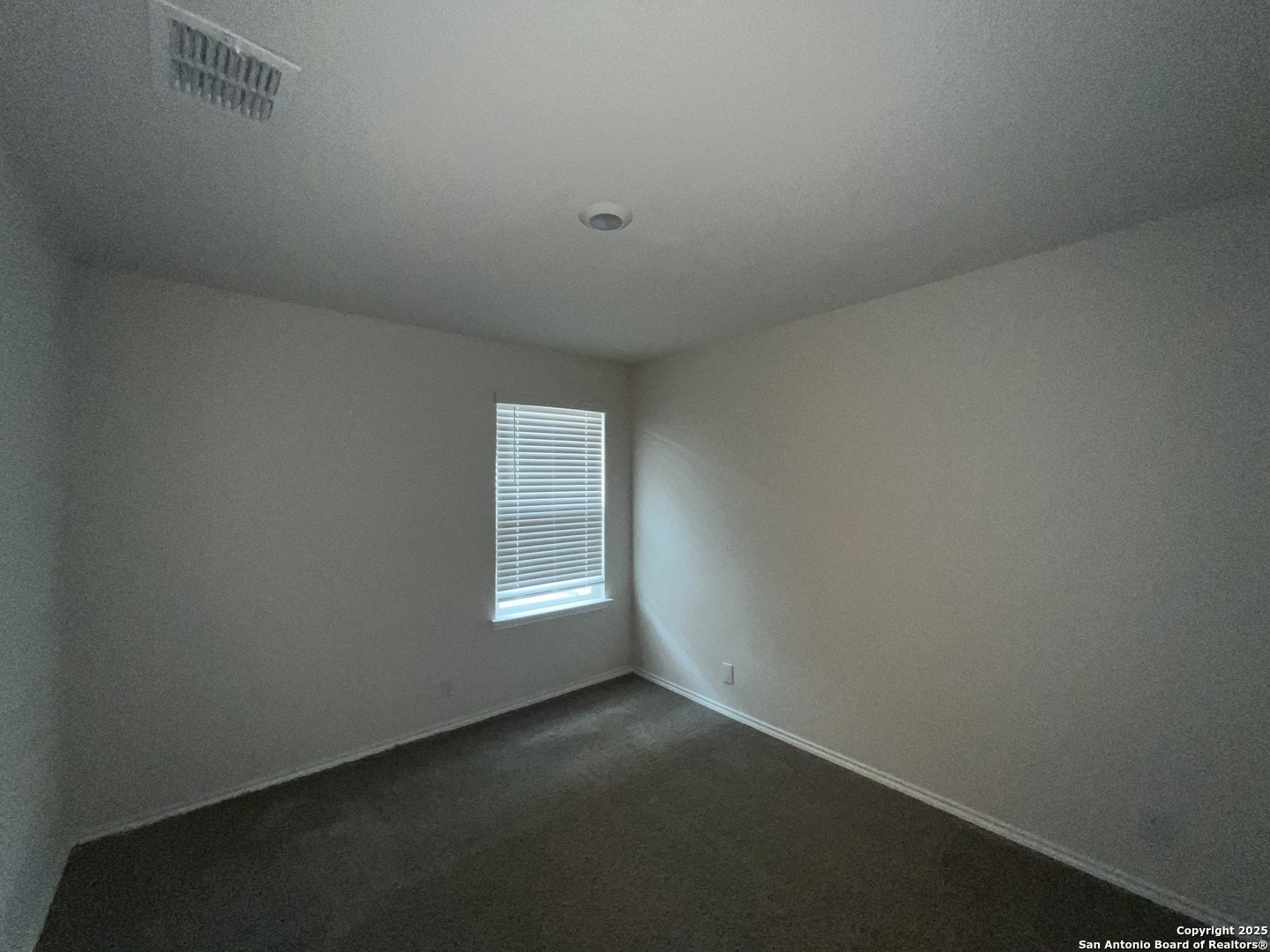 324 Middle Green Loop Floresville, TX 78114 - Photo 22 of 30 a view of empty room with window
