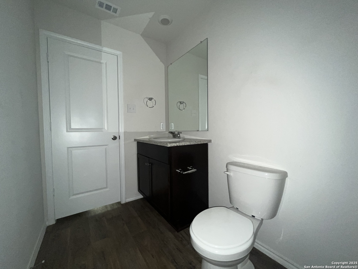 324 Middle Green Loop Floresville, TX 78114 - Photo 27 of 30 a toilet sitting in a bathroom next to a sink