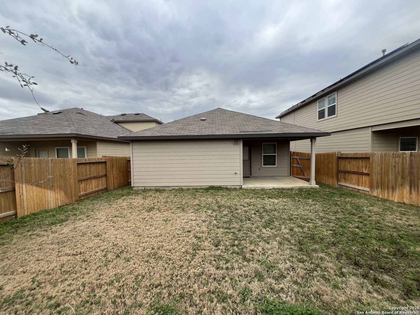 324 Middle Green Loop Floresville, TX 78114 - Photo 30 of 30 a front view of a house with garden
