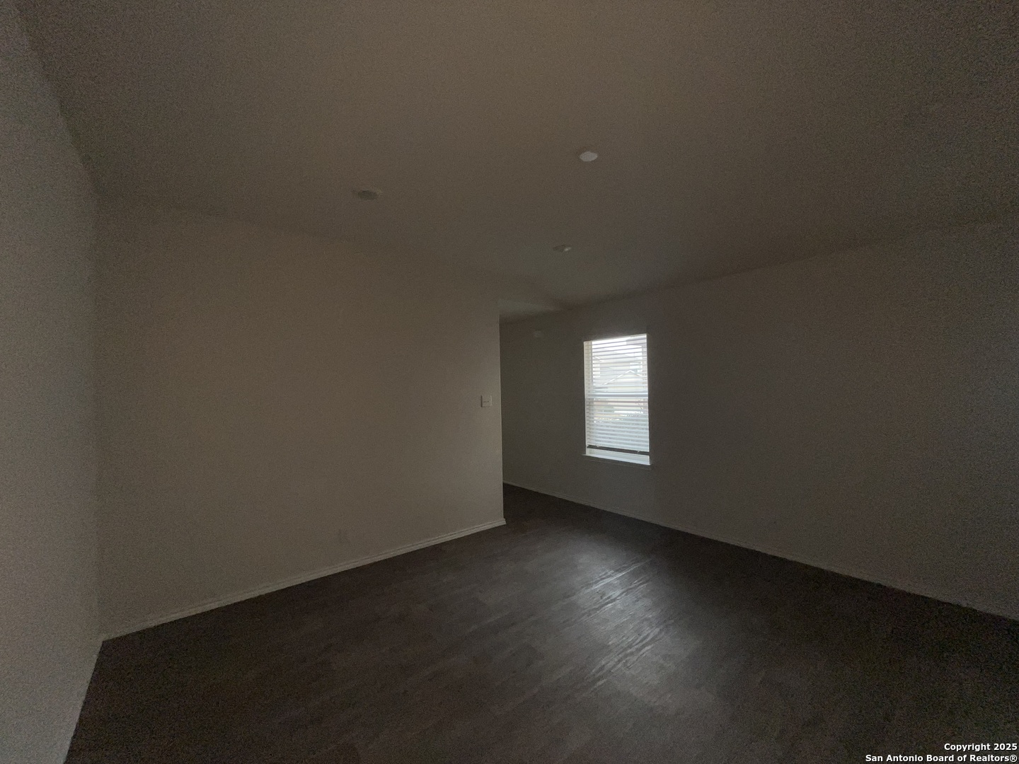 324 Middle Green Loop Floresville, TX 78114 - Photo 5 of 30 an empty room with a window