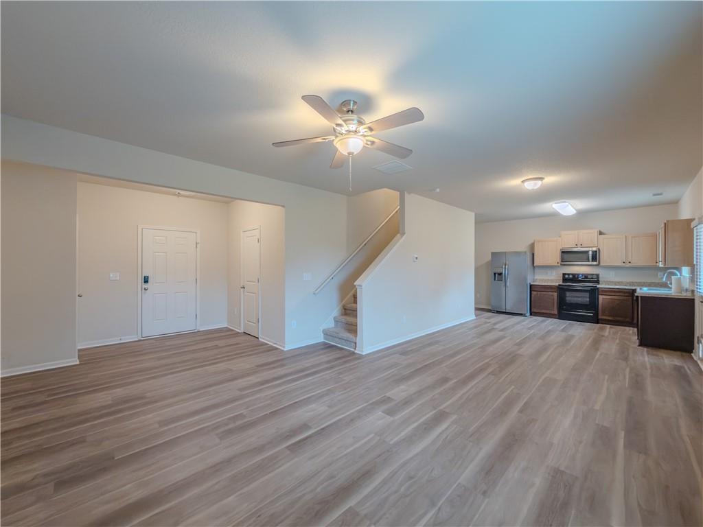 206 Morning Drive Athens, GA 30606 - Photo 2 of 36 a view of a livingroom with a ceiling fan wooden floor and a ceiling fan