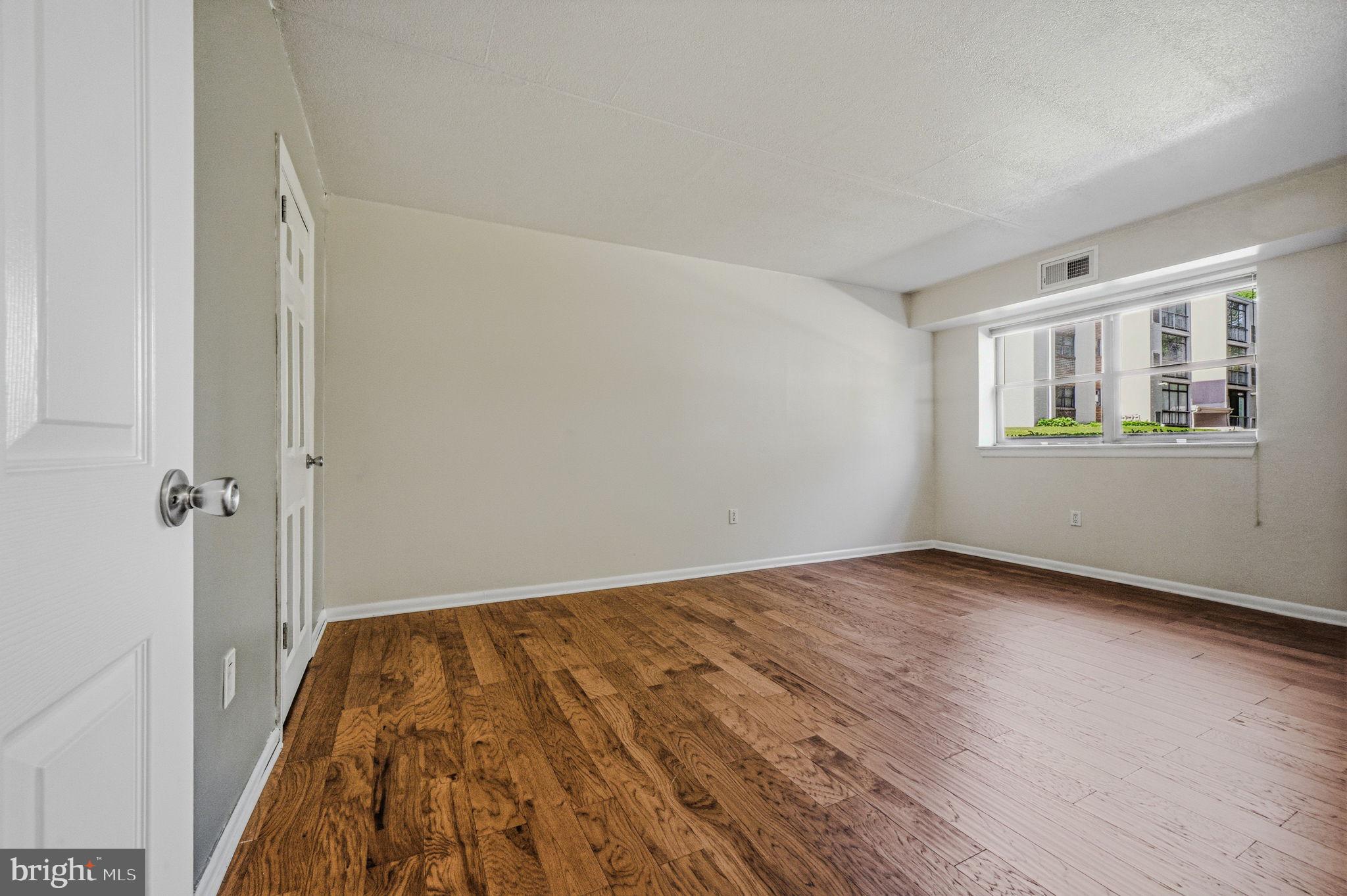 60 Welsh Tract Road, Unit 107 Newark, DE 19713 - Photo 20 of 24 a view of a room with wooden floor and a window