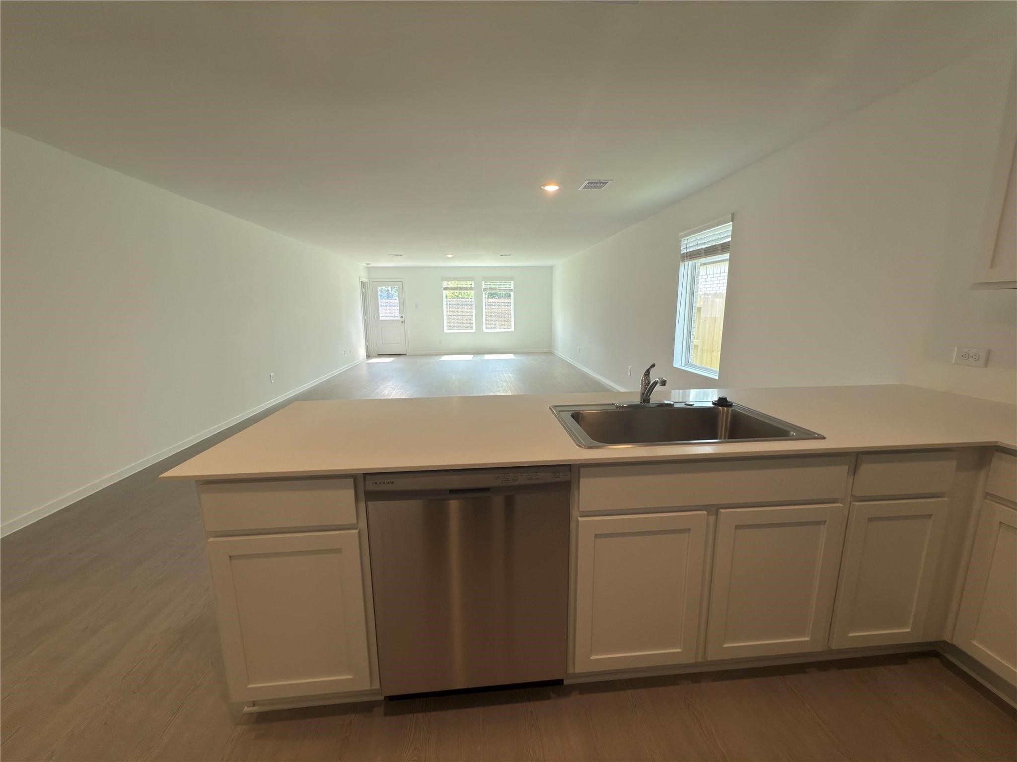 3519 Atlas Pt Lane Angleton, TX 77515 - Photo 3 of 24 a kitchen with a sink and cabinets