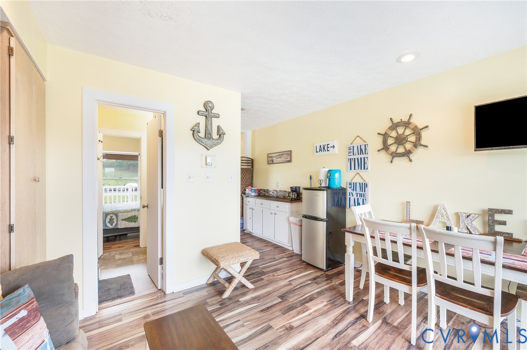 1085 Bluewater Drive, Unit 208 Moneta, VA 24121 - Photo 20 of 45 a living room with furniture and a flat screen tv