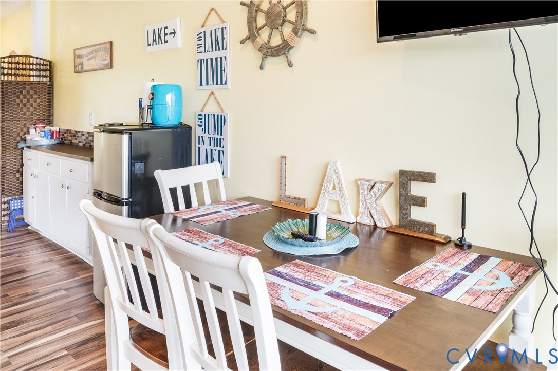 1085 Bluewater Drive, Unit 208 Moneta, VA 24121 - Photo 21 of 45 a living room with furniture and a wooden floor