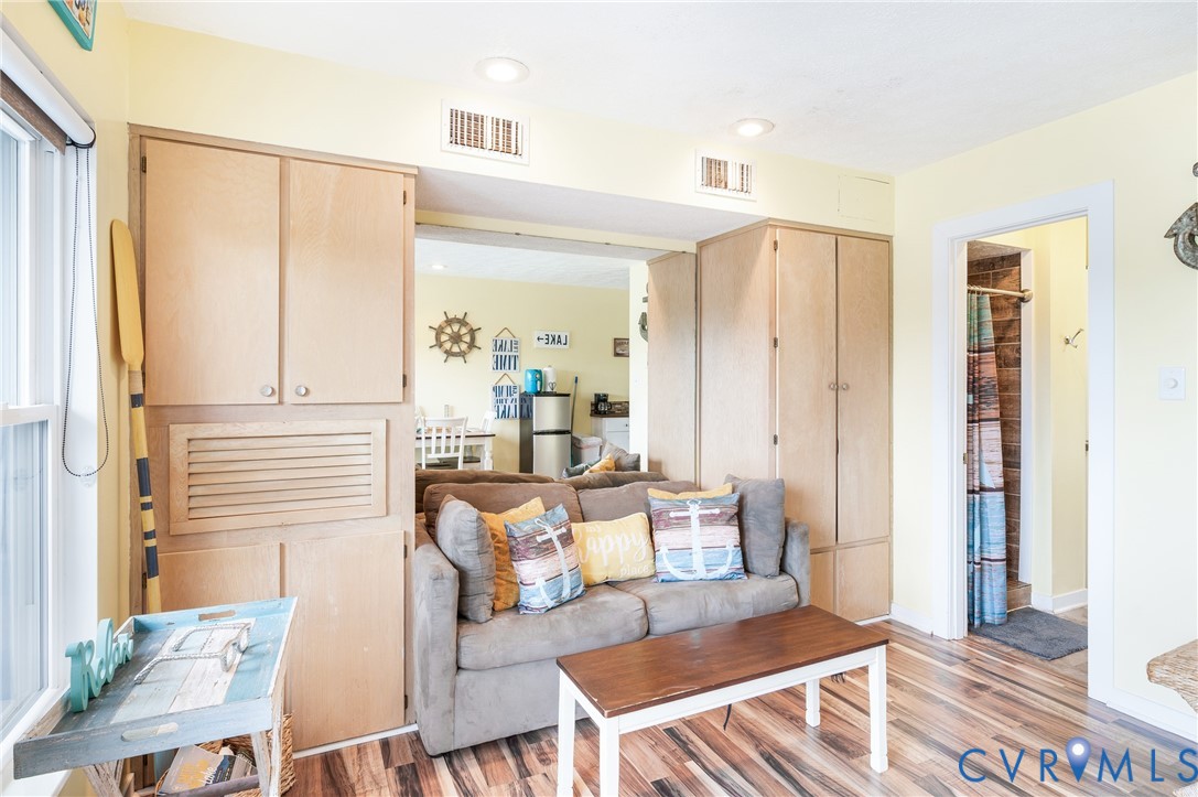 1085 Bluewater Drive, Unit 208 Moneta, VA 24121 - Photo 22 of 45 a living room with furniture and a table