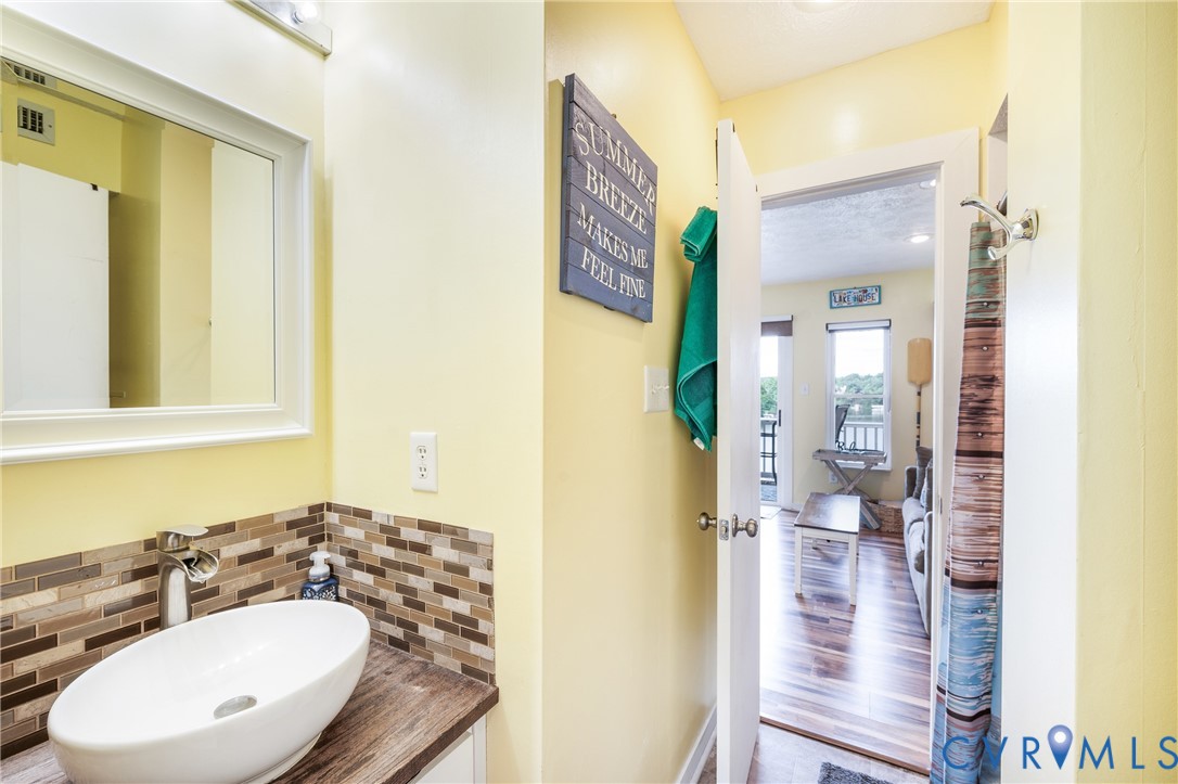 1085 Bluewater Drive, Unit 208 Moneta, VA 24121 - Photo 26 of 45 a bathroom with a sink and a mirror