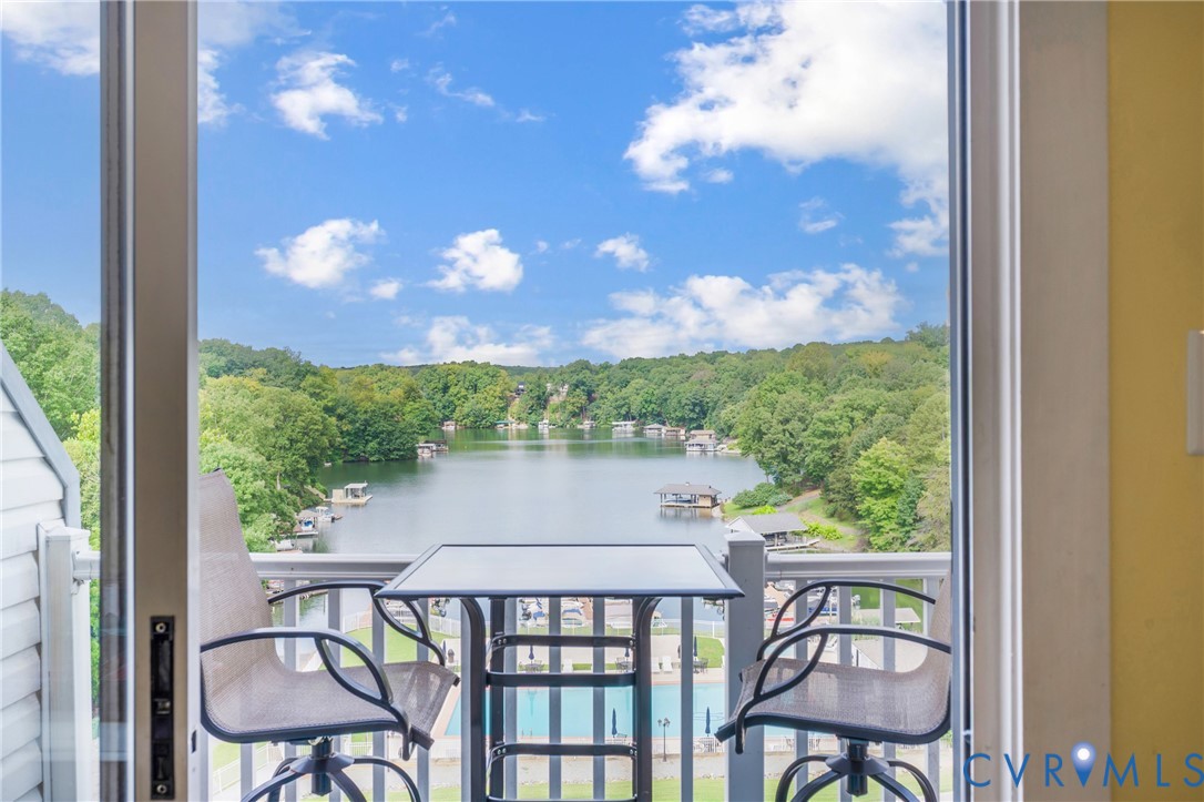 1085 Bluewater Drive, Unit 208 Moneta, VA 24121 - Photo 27 of 45 a view of a balcony with chair and table