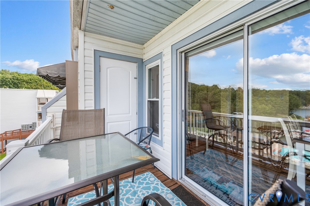 1085 Bluewater Drive, Unit 208 Moneta, VA 24121 - Photo 28 of 45 a view of a living room and floor to ceiling window