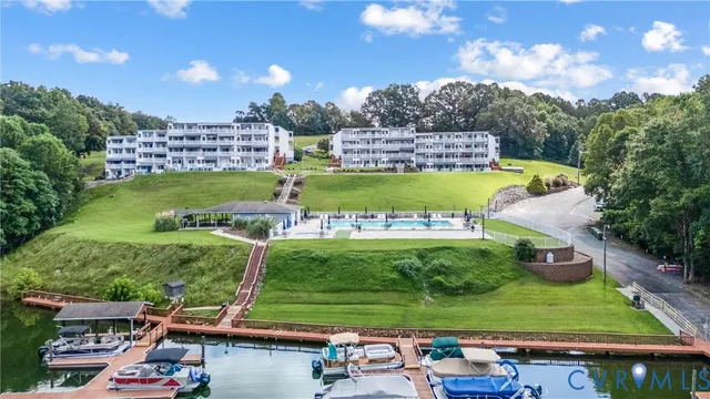 a table and chairs sitting in the middle of a lake