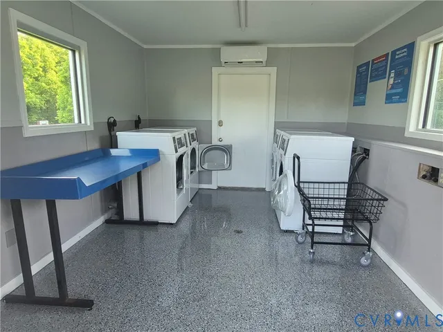 a view of swimming pool with a table and chairs under an umbrella