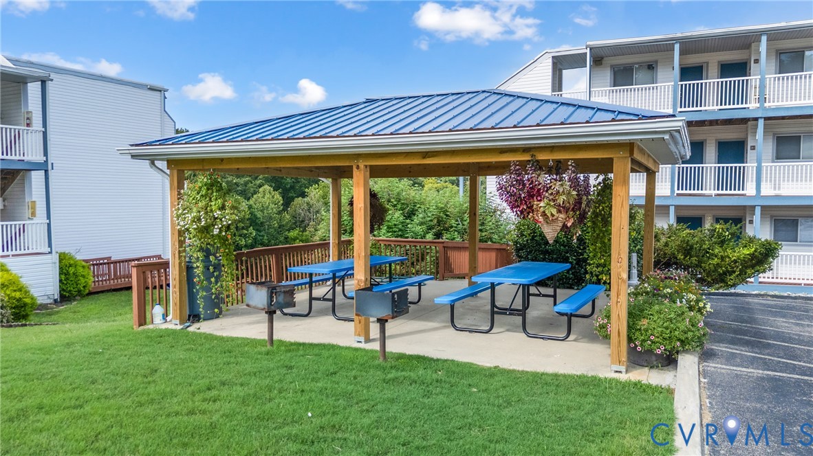 1085 Bluewater Drive, Unit 208 Moneta, VA 24121 - Photo 37 of 45 a view of a house with a backyard patio and swimming pool