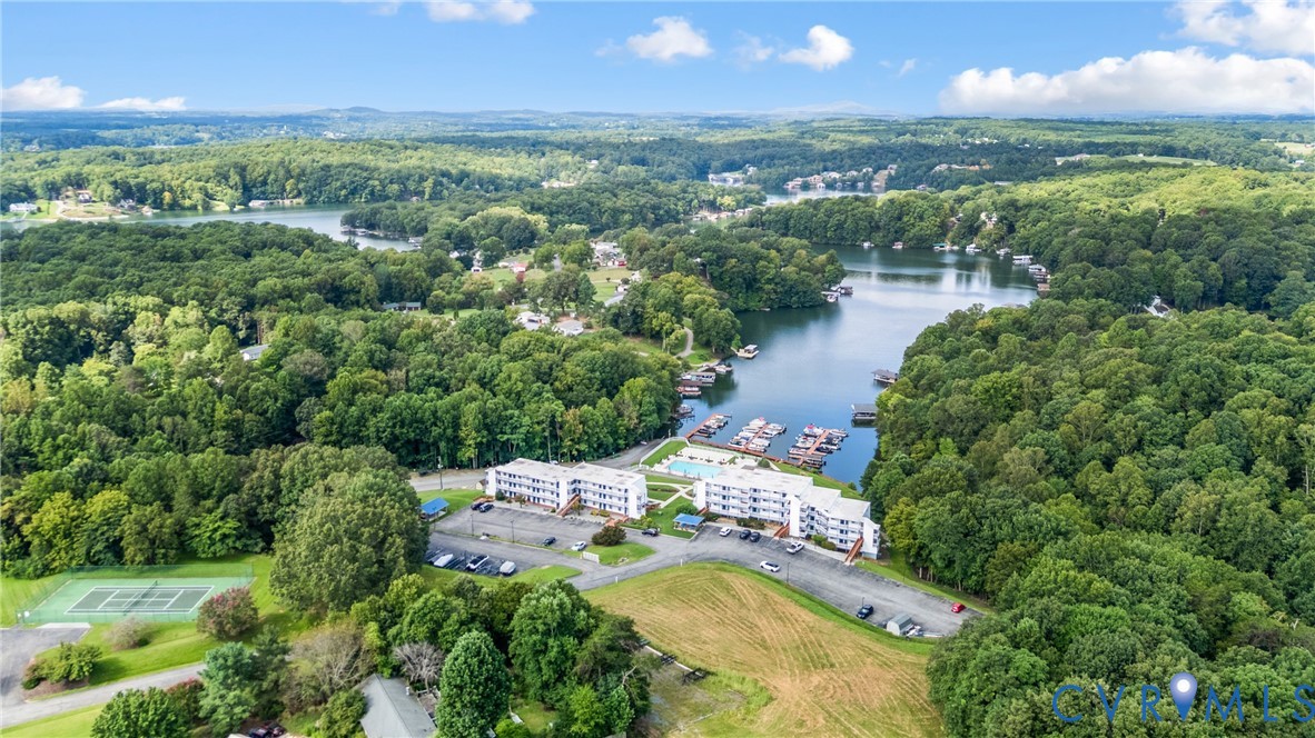 1085 Bluewater Drive, Unit 208 Moneta, VA 24121 - Photo 41 of 45 an aerial view of a house with a yard and lake view