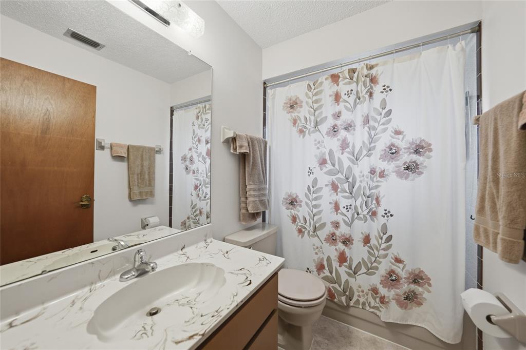 23035 Rye Avenue Punta Gorda, FL 33980 - Photo 15 of 20 a bathroom with a sink toilet and shower