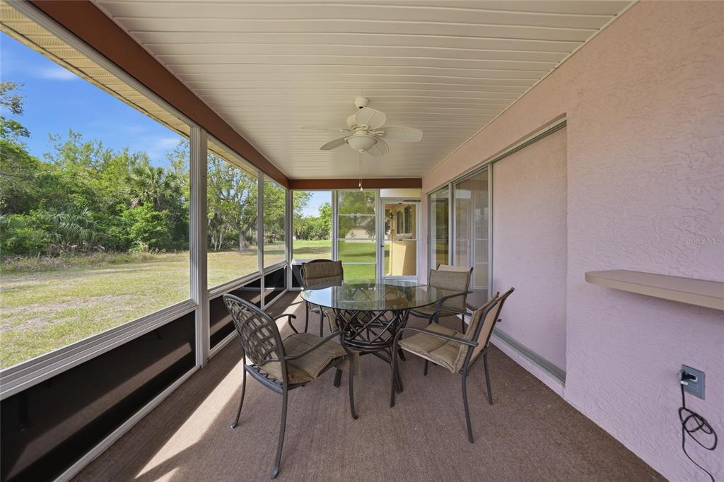 23035 Rye Avenue Punta Gorda, FL 33980 - Photo 17 of 20 a dining room with furniture and wooden floor
