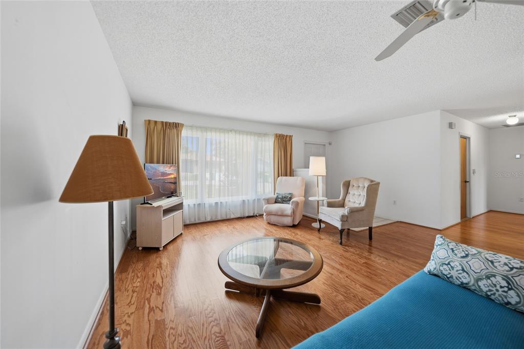 23035 Rye Avenue Punta Gorda, FL 33980 - Photo 5 of 20 a living room with furniture and a wooden floor