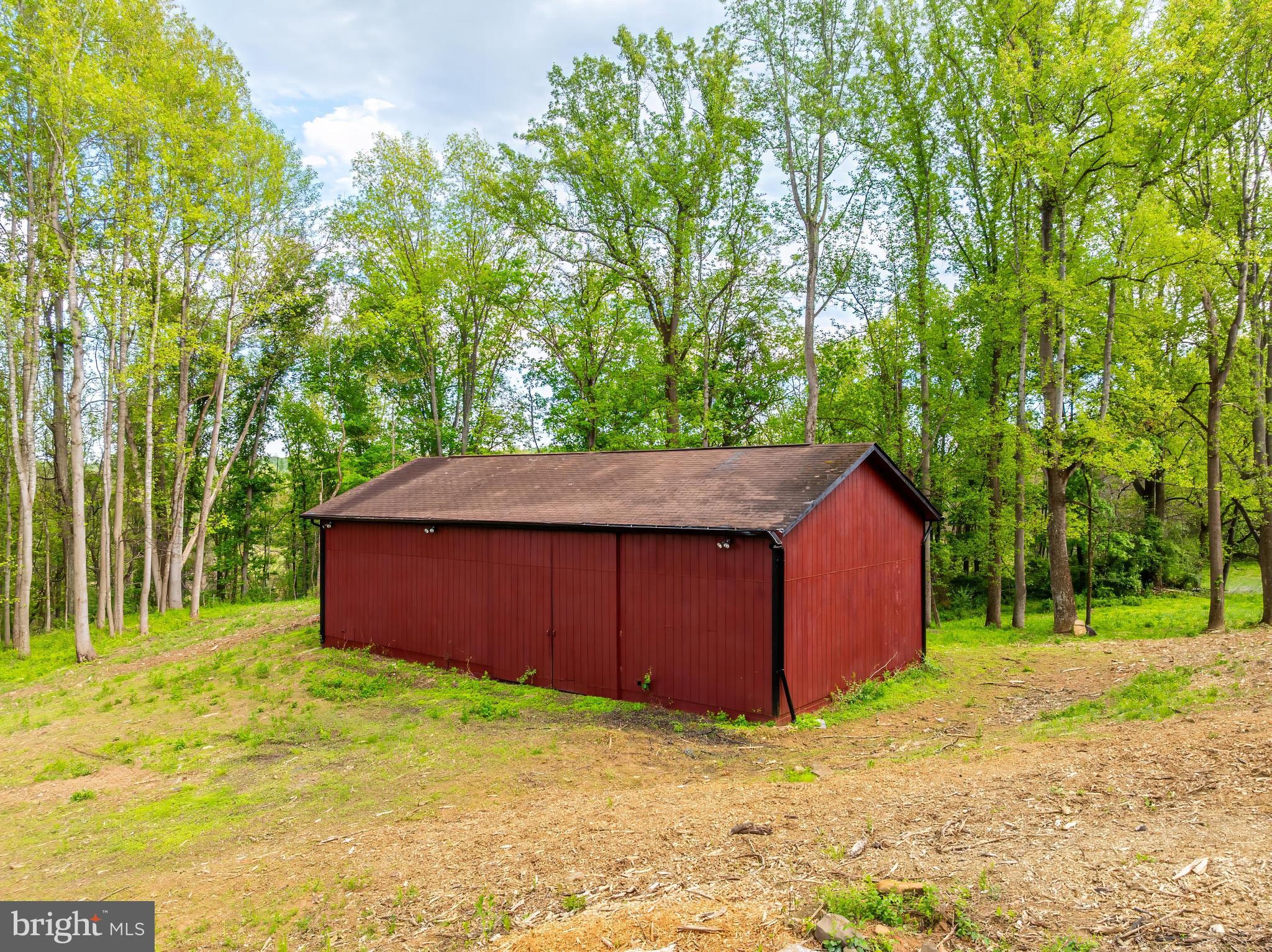 6891 Wilson Road Marshall, VA 20115 - Photo 33 of 118 Charming red barn nestled in greenery.