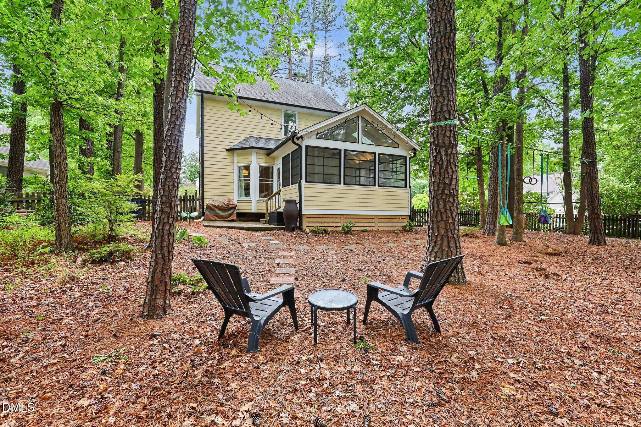 5468 Ingate Way Raleigh, NC 27613 - Photo 24 of 24 a view of house with backyard and outdoor seating